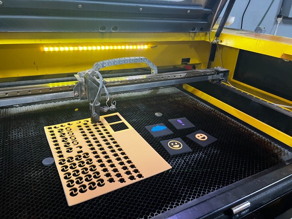 Laser cutter cutting a sheet of material